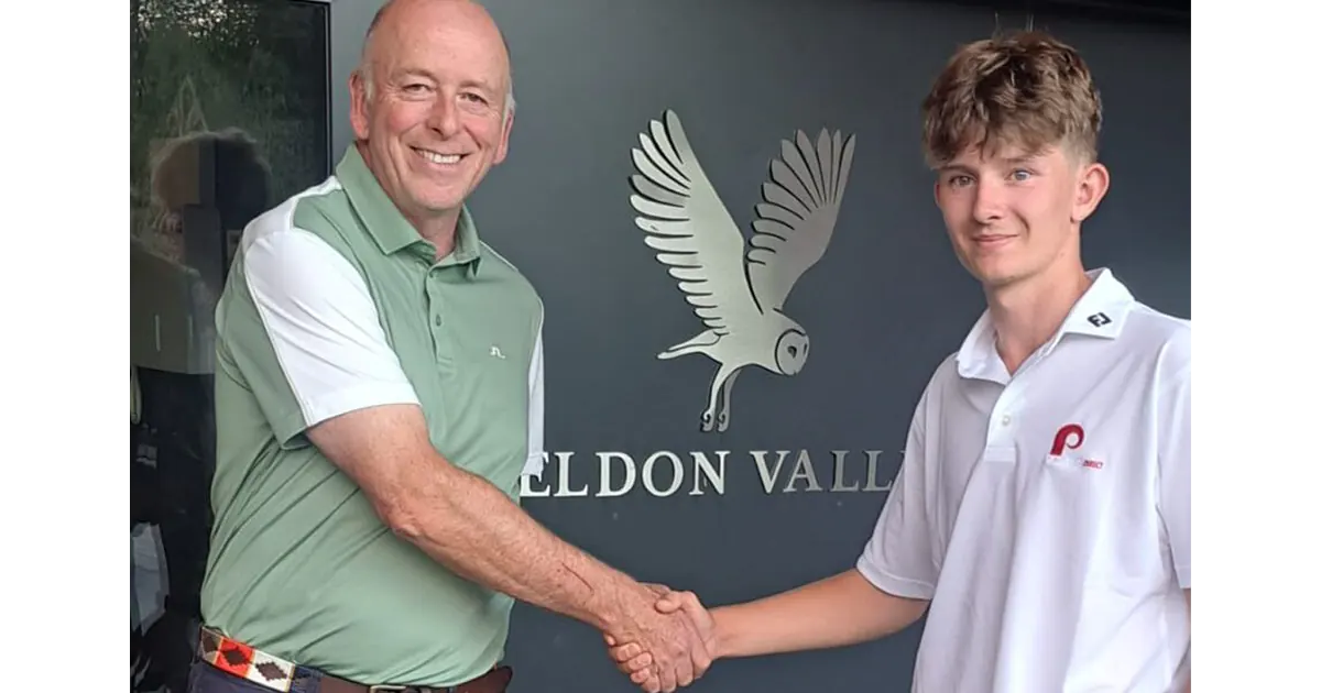 Joe Bowes and Isaac Hayes shaking hands in front of Feldon Valley golf club sign
